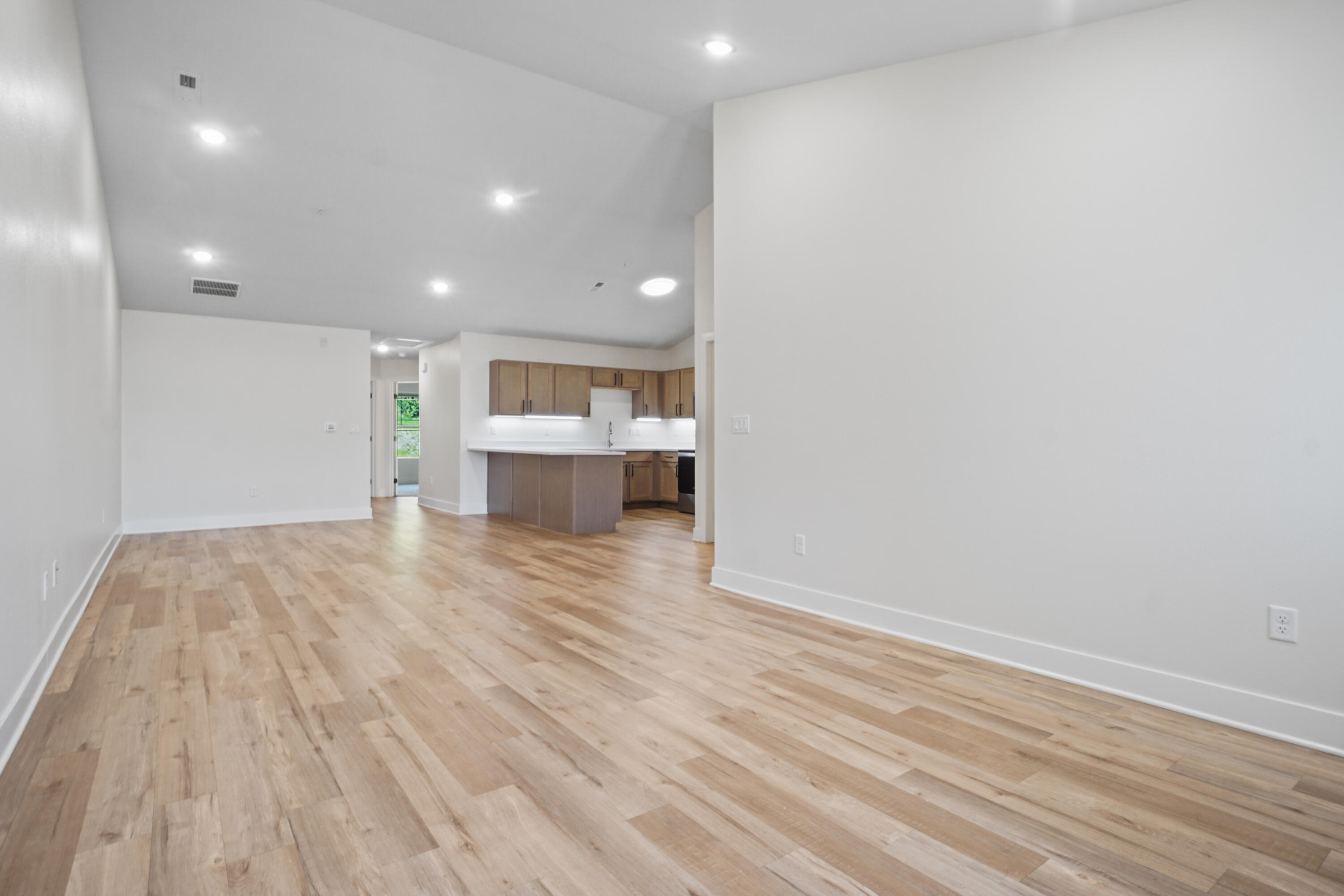 117 Eiche Drive, Unit 2 Slinger, WI 53086 - Photo 7 of 24 Great Room/Dining Area