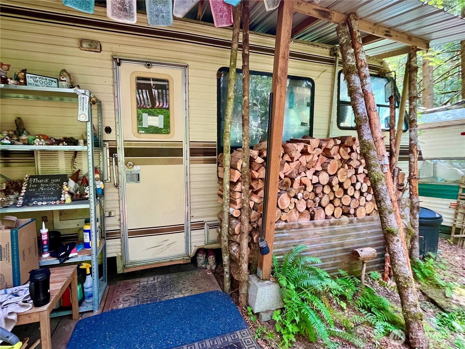 0 Cascade River Road, Unit 1208 Marblemount, WA 98267 - Photo 4 of 12 a front view of a house with outdoor seating