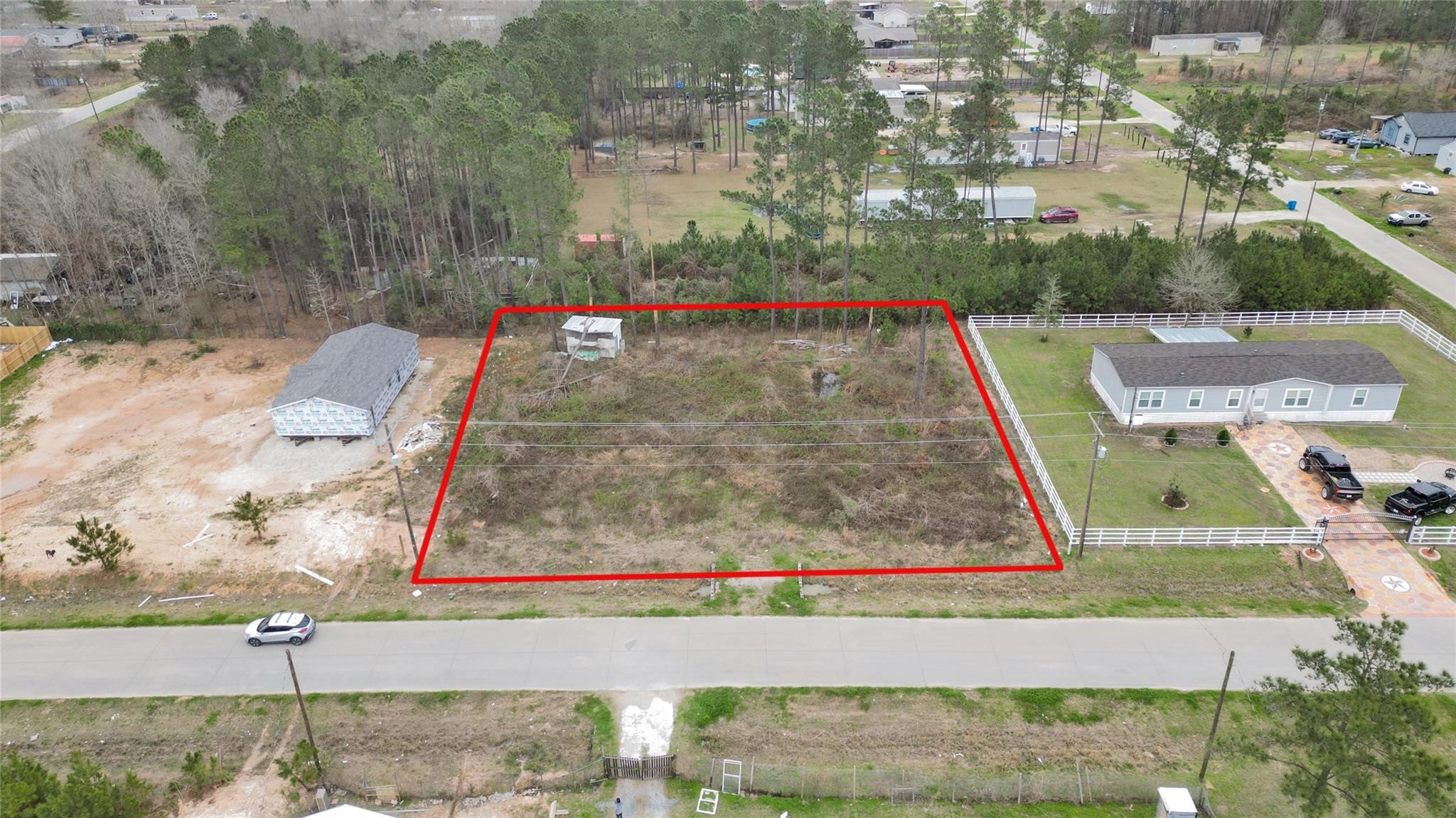 296 County Road 377 Cleveland, TX 77327 - Photo 1 of 10 a view of yard along with trees