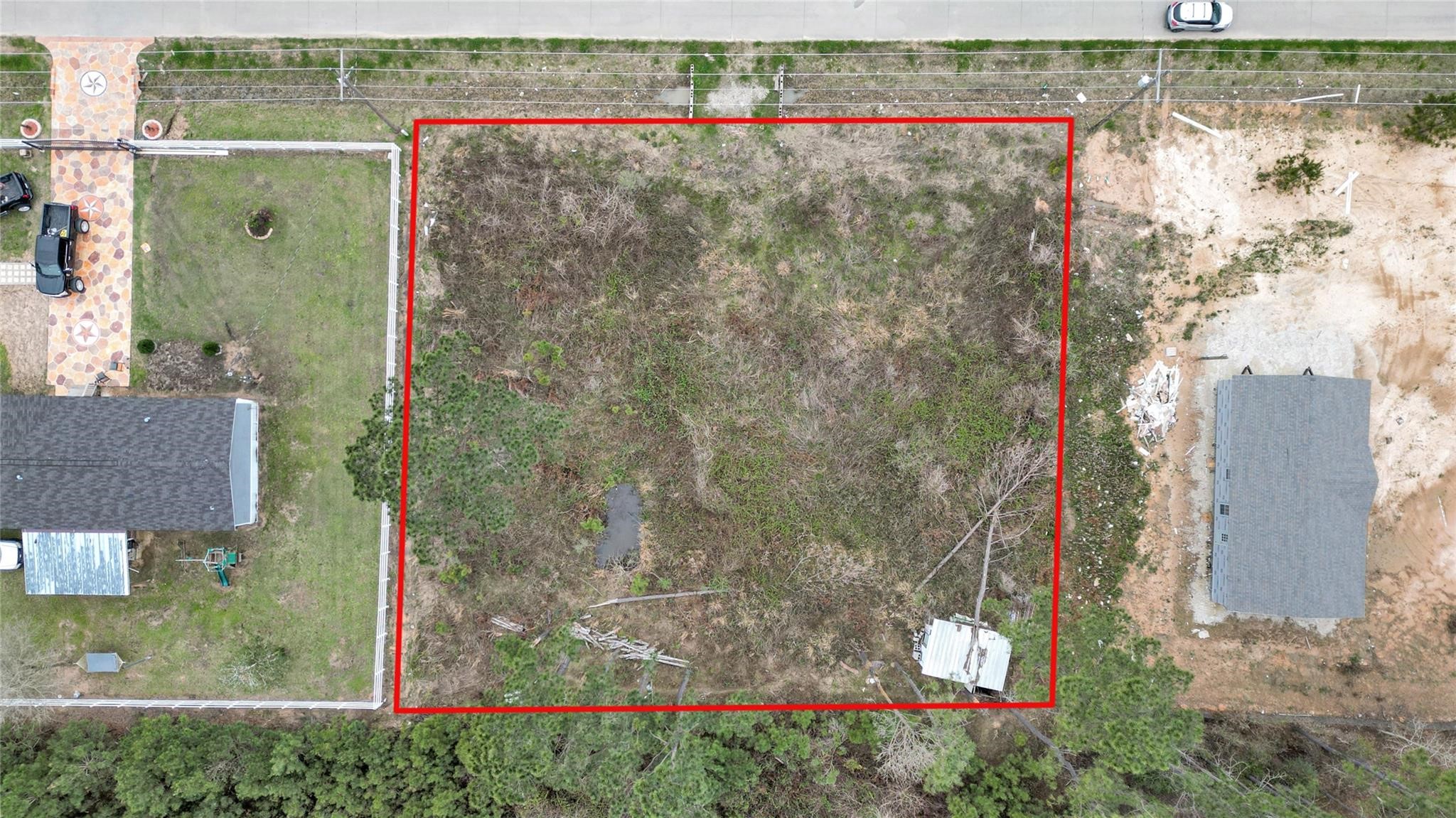 296 County Road 377 Cleveland, TX 77327 - Photo 3 of 10 an aerial view of a house with a yard