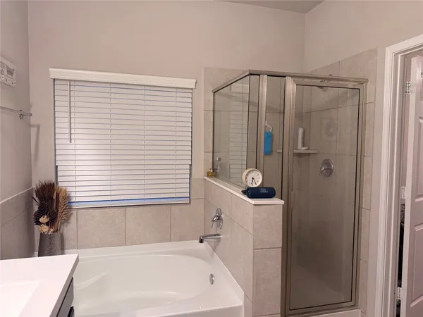 a bedroom with furniture and a book shelf
