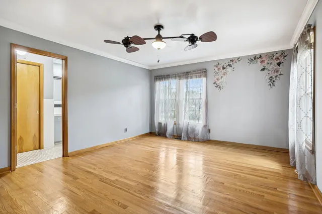 a view of a room with wooden floor
