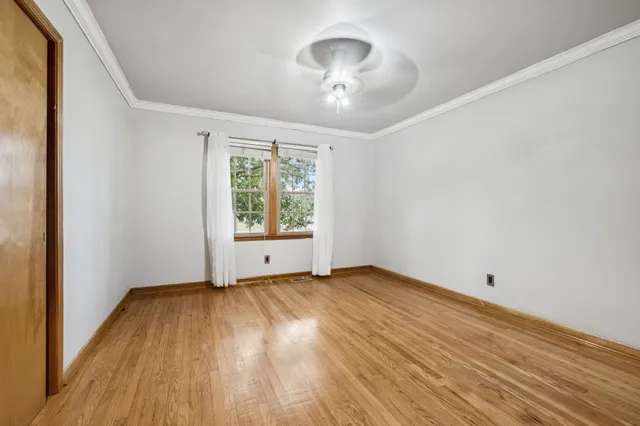 a view of living room with furniture and a window