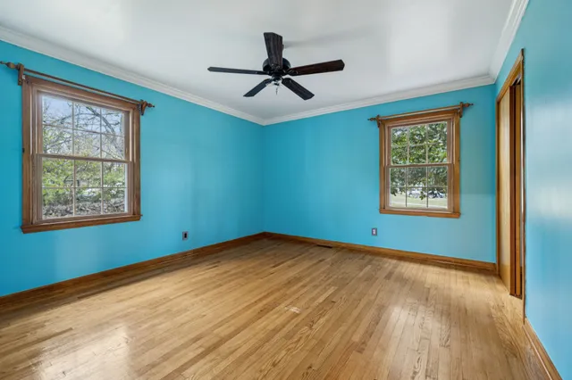 a bathroom with a double vanity sink toilet and a mirror