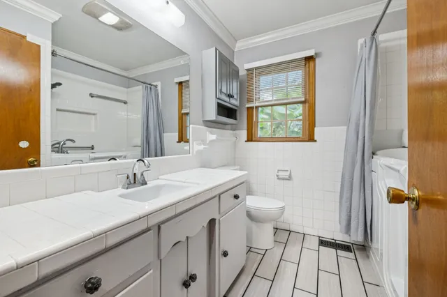 a backyard of a house with lots of green space and fountain