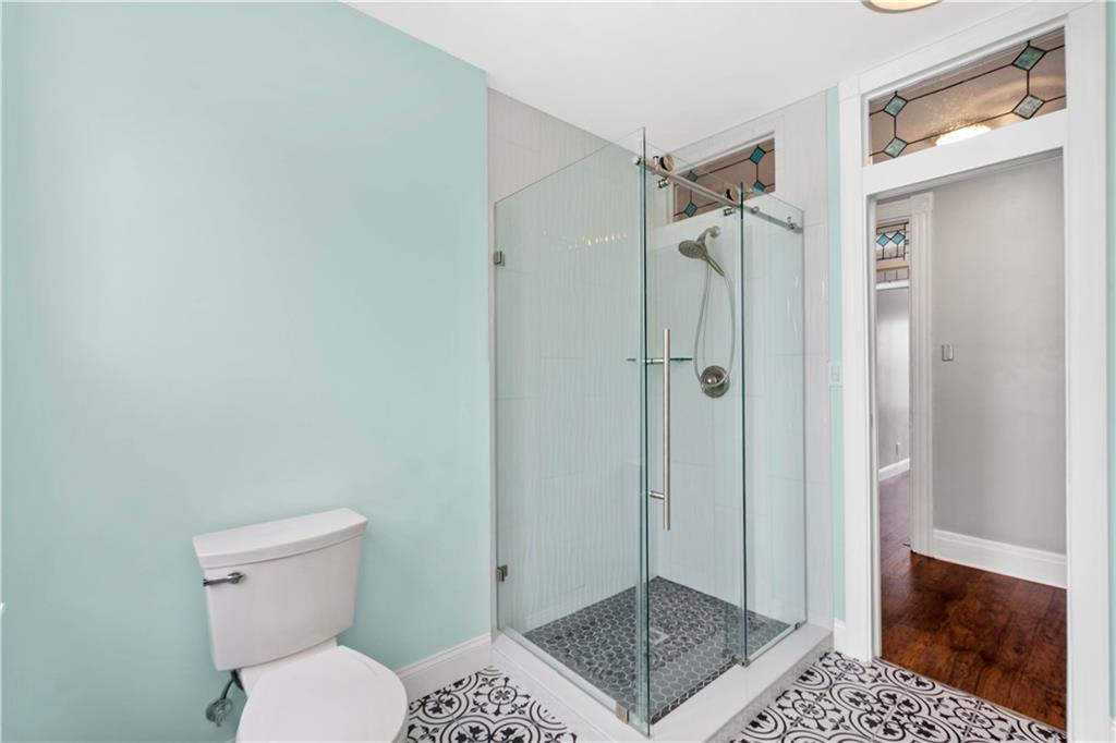 162 Locarna Way Pittsburgh, PA 15201 - Photo 13 of 25 a bathroom with a shower a toilet and a sink