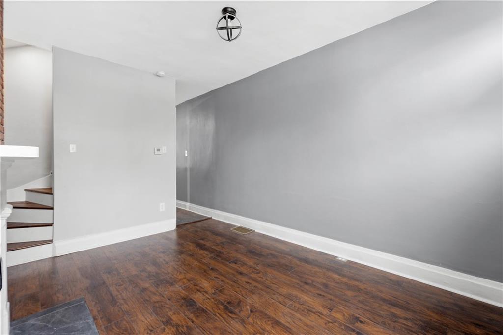 162 Locarna Way Pittsburgh, PA 15201 - Photo 17 of 25 a view of an empty room with wooden floor