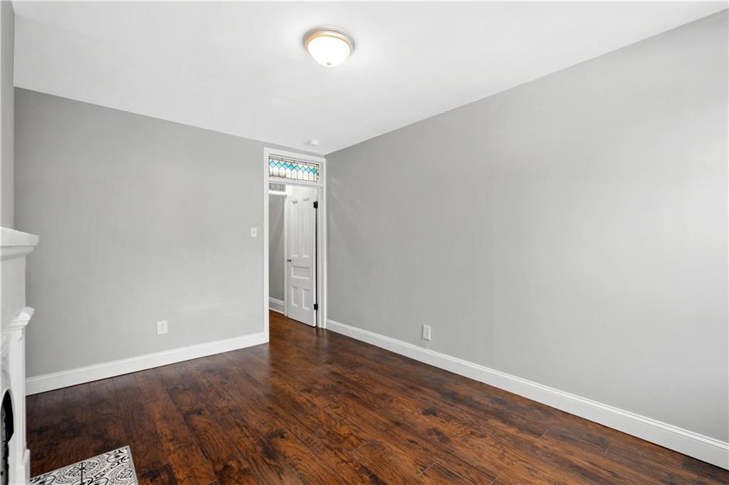 162 Locarna Way Pittsburgh, PA 15201 - Photo 19 of 25 an empty room with wooden floor and windows