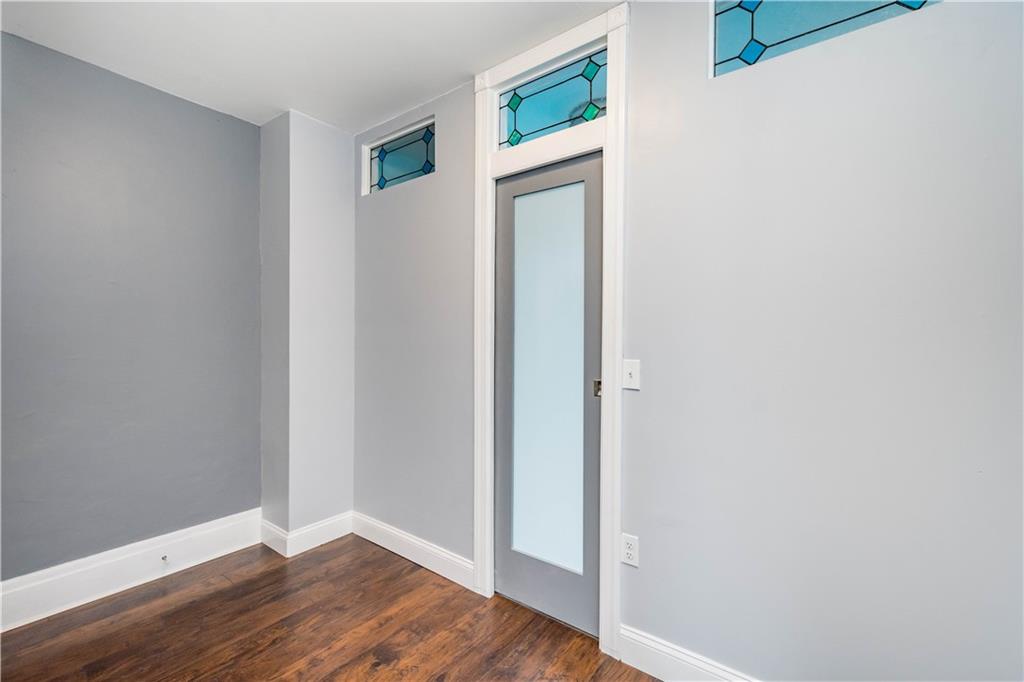 162 Locarna Way Pittsburgh, PA 15201 - Photo 20 of 25 a view of an empty room with wooden floor