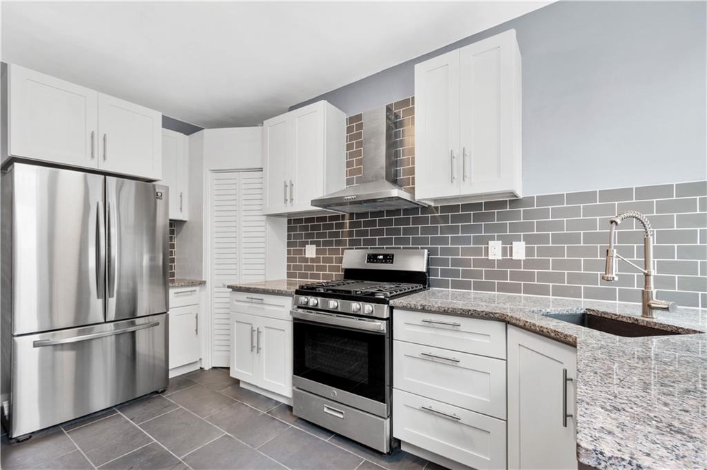 162 Locarna Way Pittsburgh, PA 15201 - Photo 6 of 25 a kitchen with granite countertop cabinets stainless steel appliances and a sink