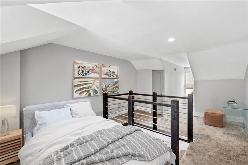 162 Locarna Way Pittsburgh, PA 15201 - Photo 10 of 25 a bedroom with a bed and a painting on the wall