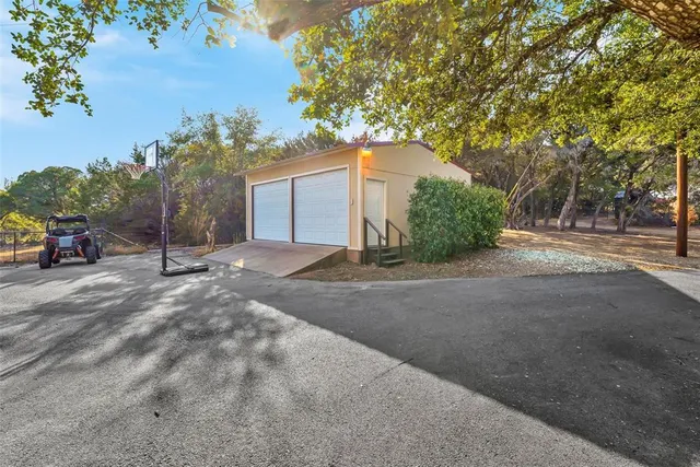a view of a house with a street