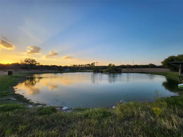 a view of lake with green space