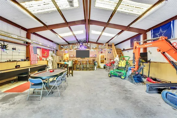 a view of a garage with a table and chairs