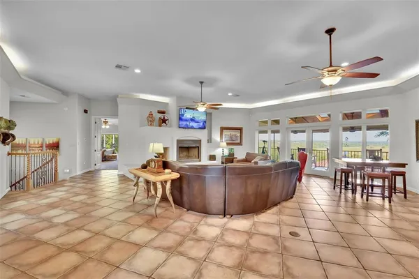 a living room with furniture and kitchen view