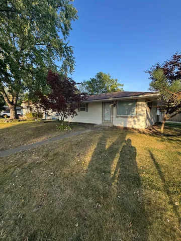 a view of a water fountain in front of a house