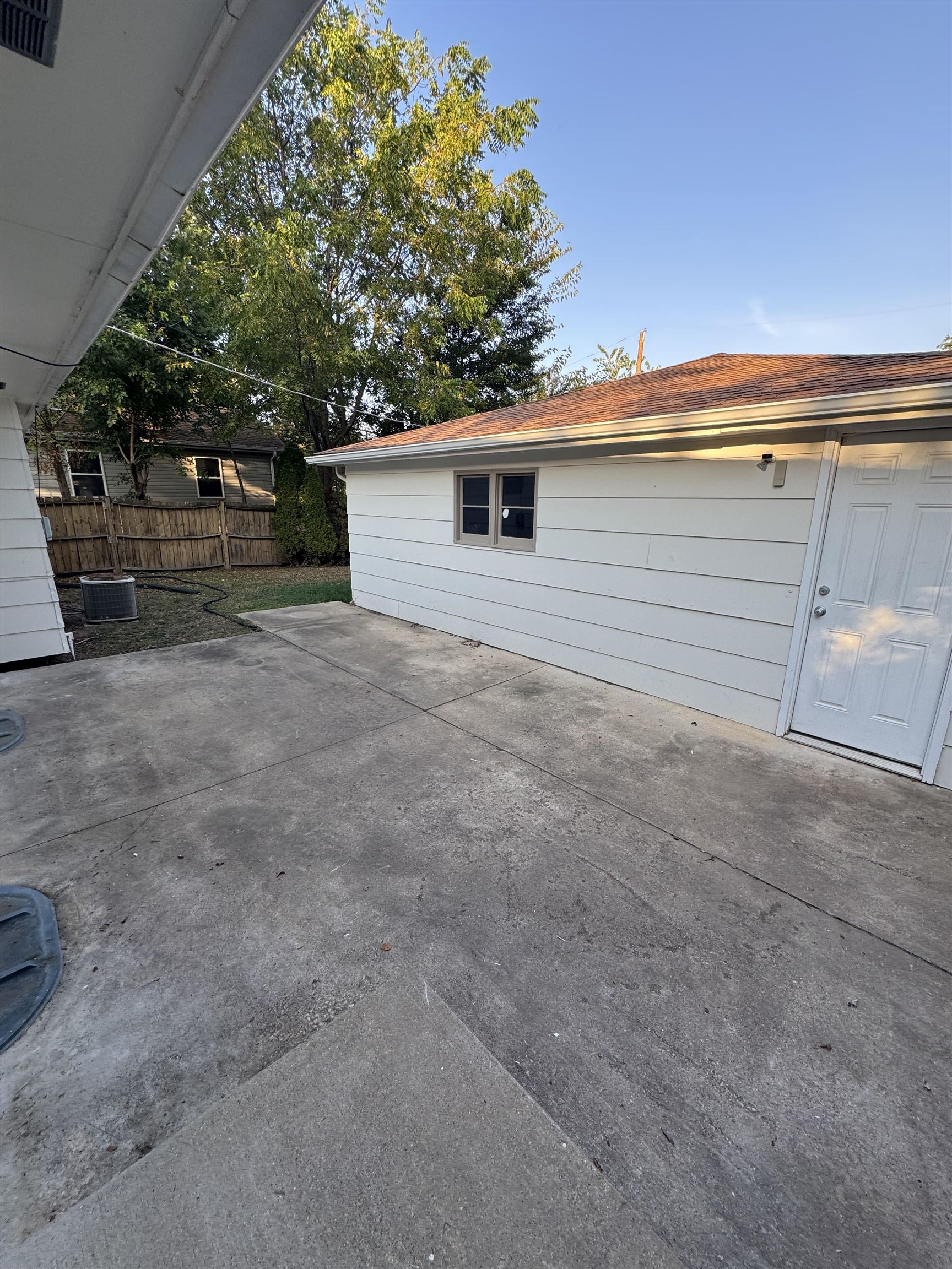 1120 Esmond Drive Rockford, IL 61108 - Photo 4 of 20 a front view of a house with a yard and garage