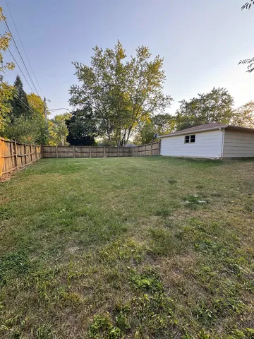 a view of a field with an trees