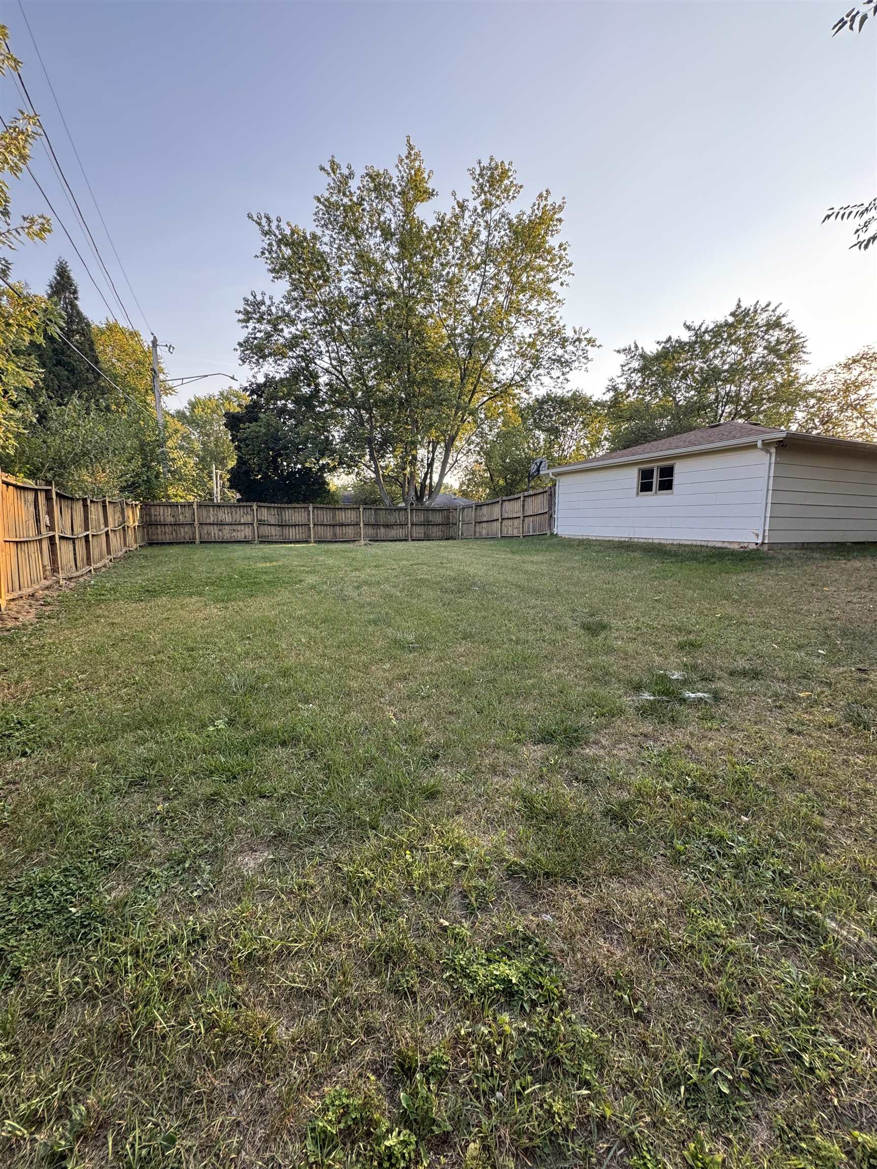 1120 Esmond Drive Rockford, IL 61108 - Photo 7 of 20 a view of a field with an trees