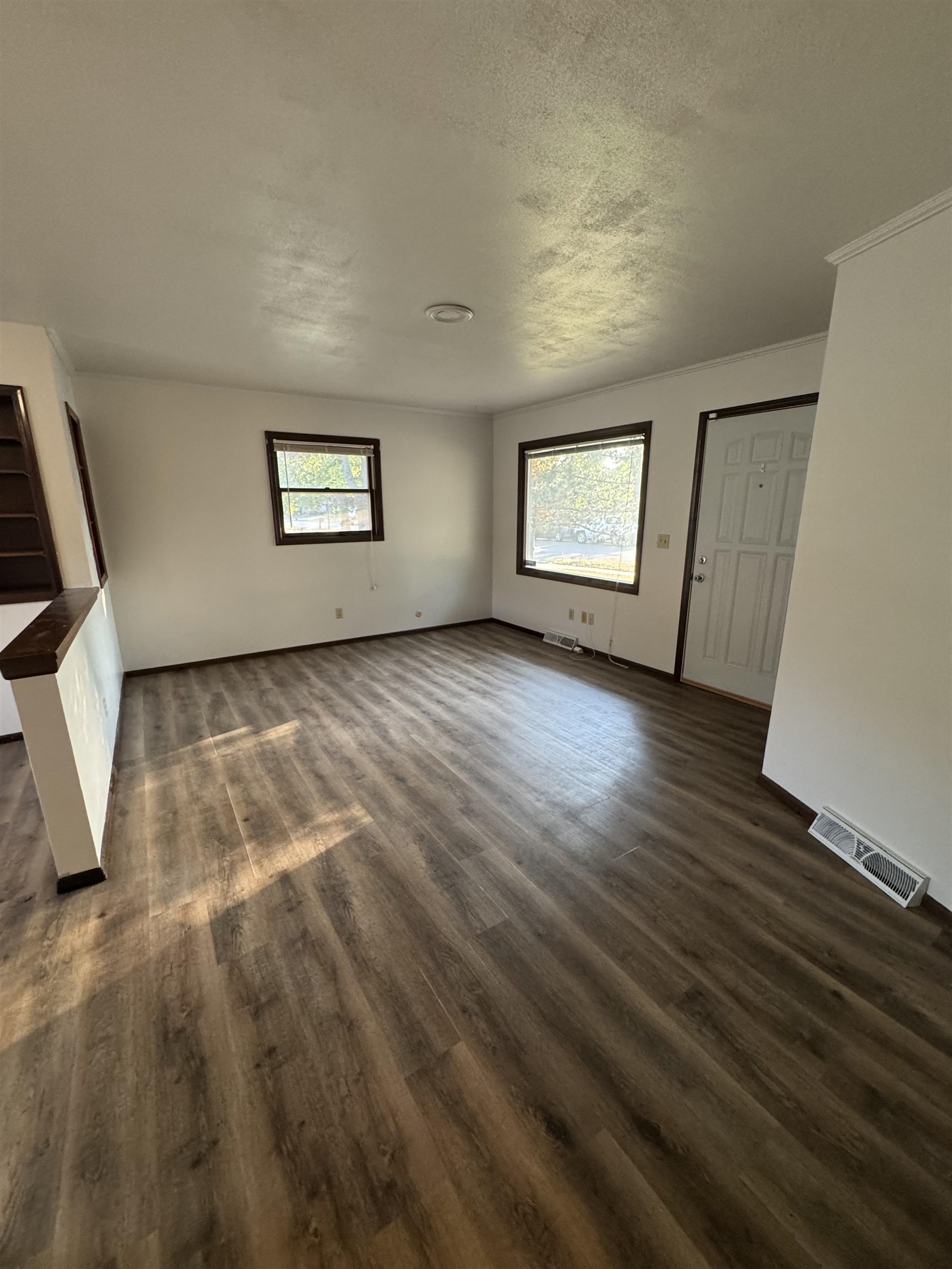 1120 Esmond Drive Rockford, IL 61108 - Photo 9 of 20 an empty room with wooden floor and windows