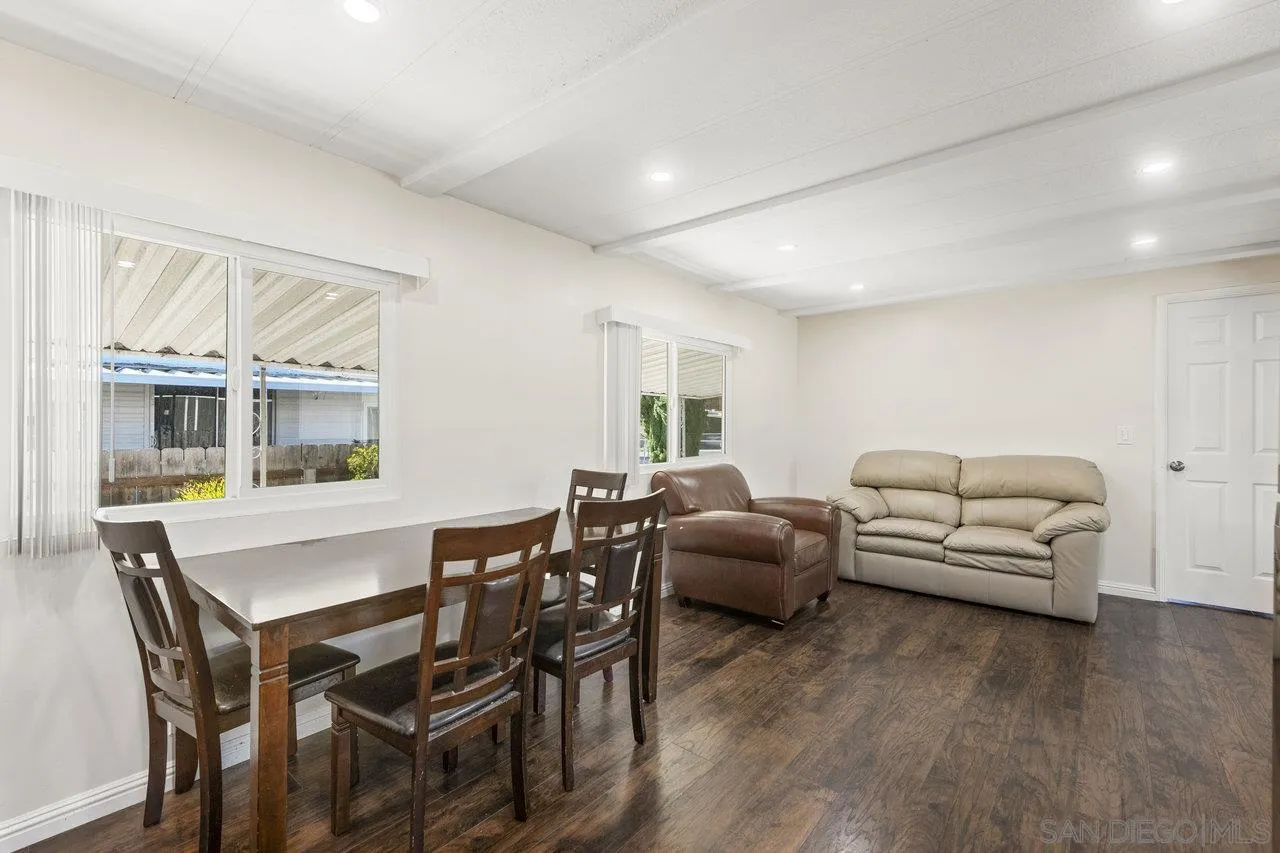 900 Howard Avenue, Unit 54 Escondido, CA 92029 - Photo 11 of 25 a living room with furniture and a large window