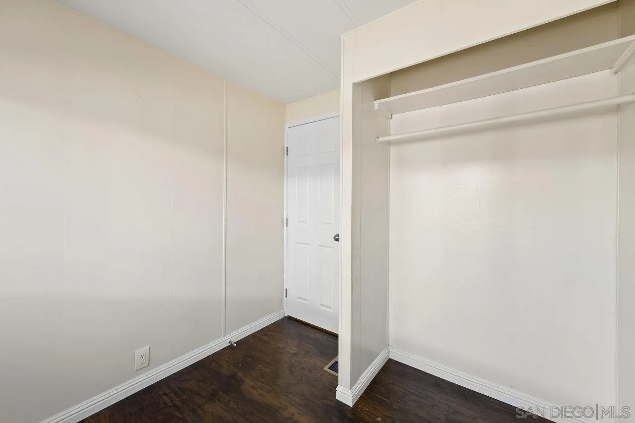 900 Howard Avenue, Unit 54 Escondido, CA 92029 - Photo 19 of 25 a view of an empty room with wooden floor