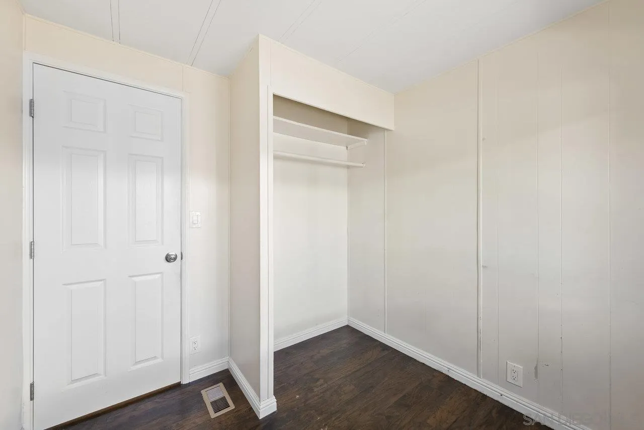 900 Howard Avenue, Unit 54 Escondido, CA 92029 - Photo 20 of 25 an empty room with wooden floor