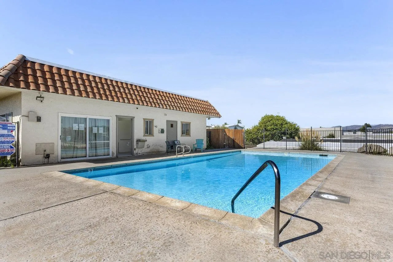 900 Howard Avenue, Unit 54 Escondido, CA 92029 - Photo 22 of 25 a swimming pool with outdoor seating and yard