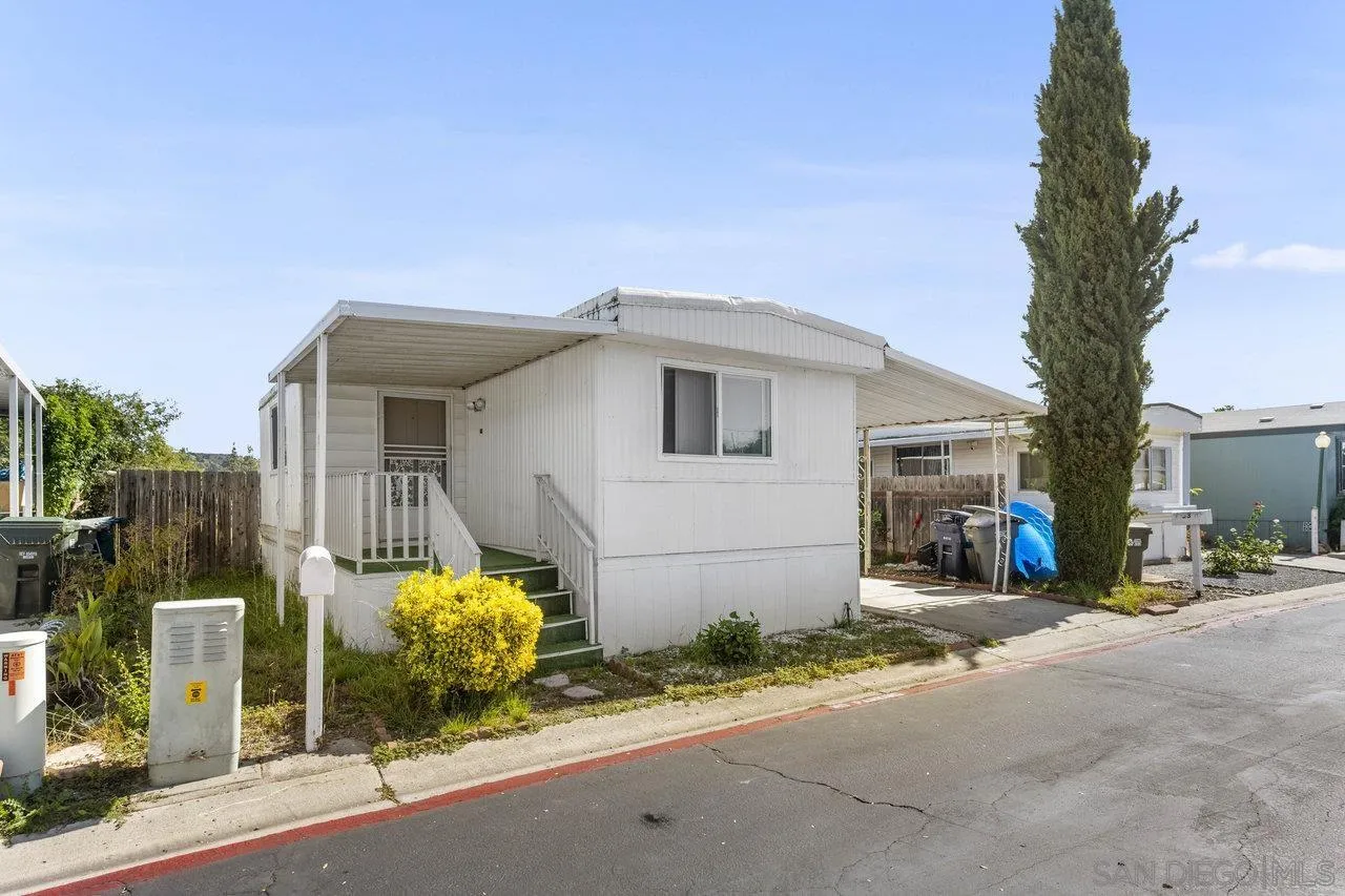 900 Howard Avenue, Unit 54 Escondido, CA 92029 - Photo 3 of 25 a view of a house with a patio and a yard