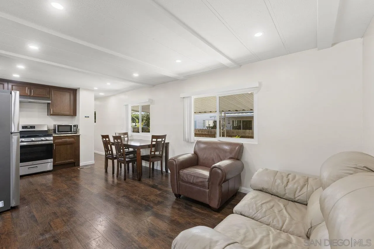 900 Howard Avenue, Unit 54 Escondido, CA 92029 - Photo 6 of 25 a living room with furniture and kitchen view