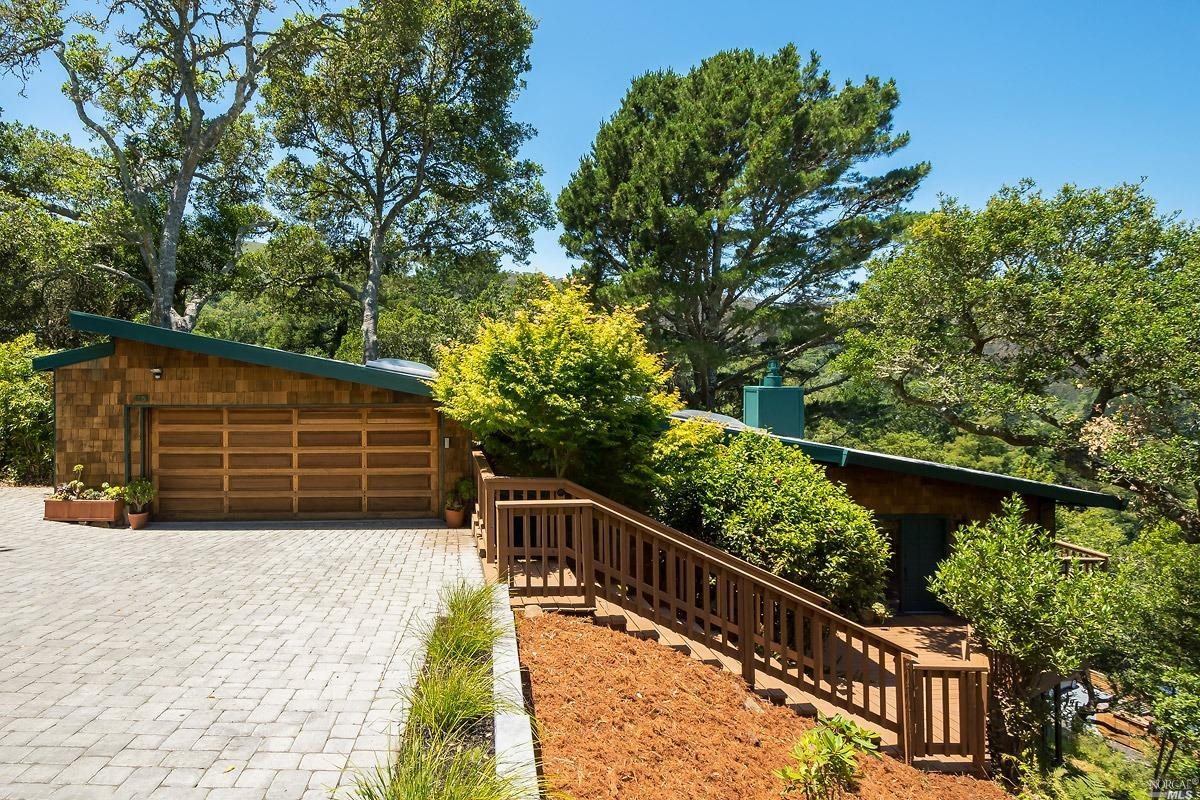 a view of balcony with wooden floor and fence