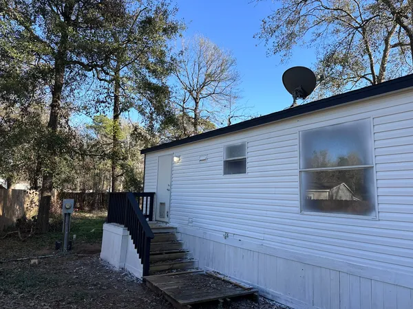a view of backyard of a house