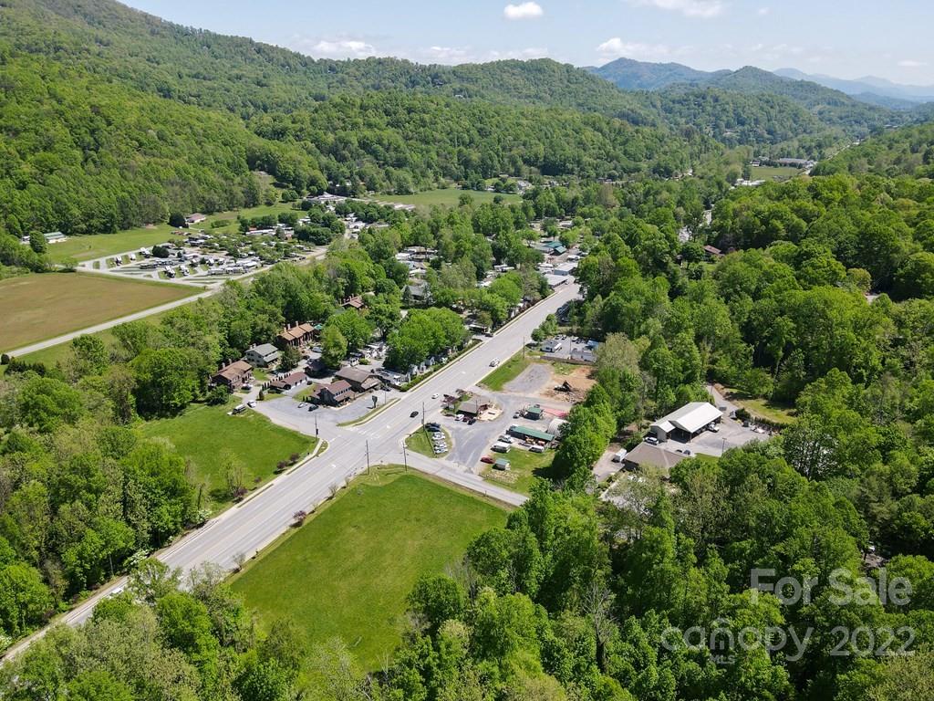 9999 A Soco Road Maggie Valley, NC 28751 - Photo 14 of 29 an aerial view of residential houses with outdoor space and trees all around