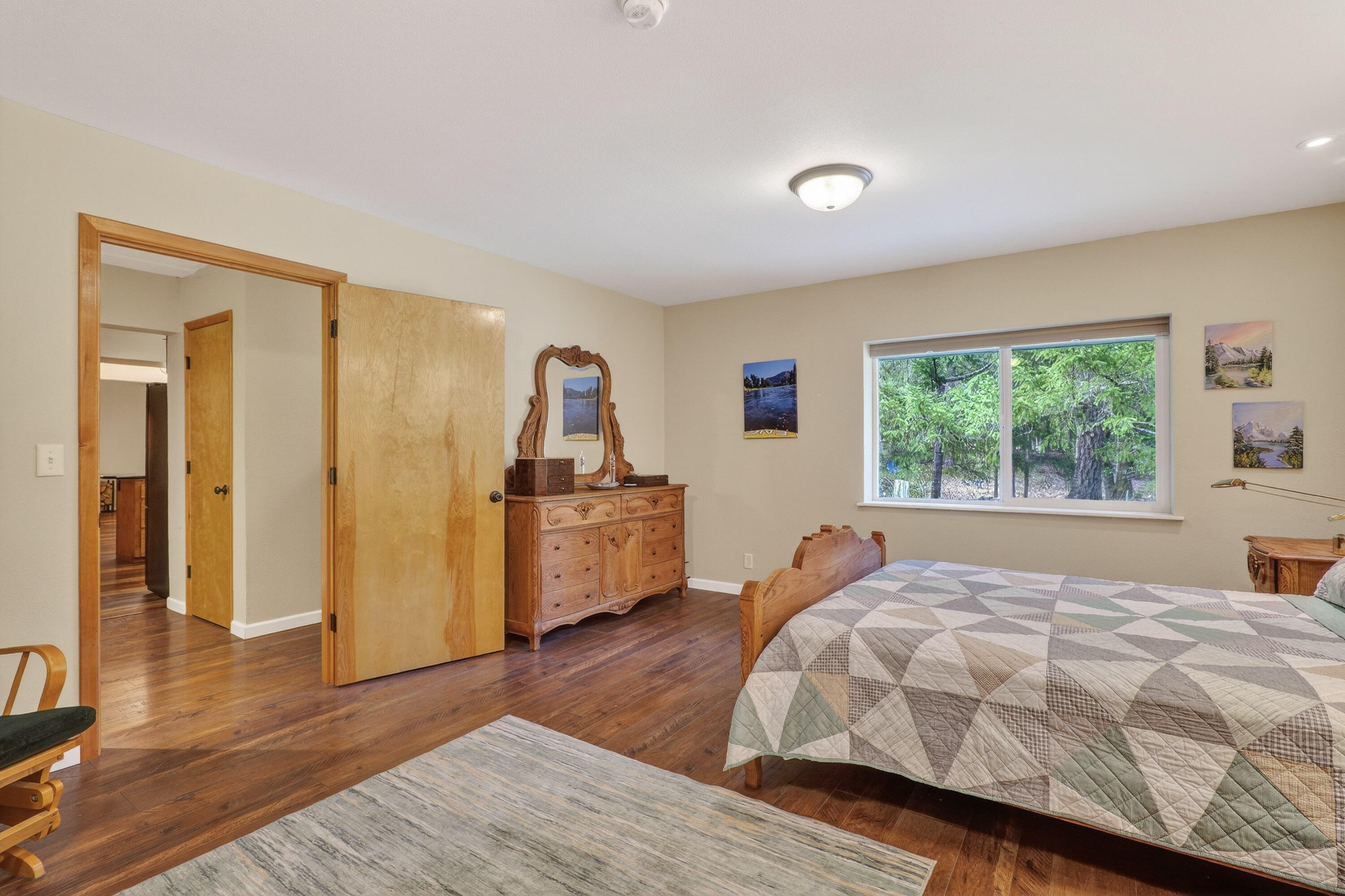 244 Riessen Road Grants Pass, OR 97526 - Photo 19 of 52 a bed room with a bed and a window