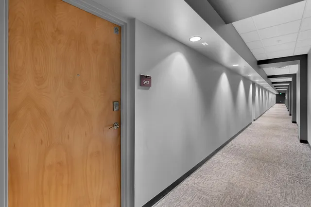 an aerial view of a house with wooden stairs