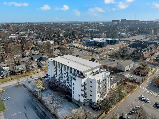 an aerial view of residential houses with outdoor space