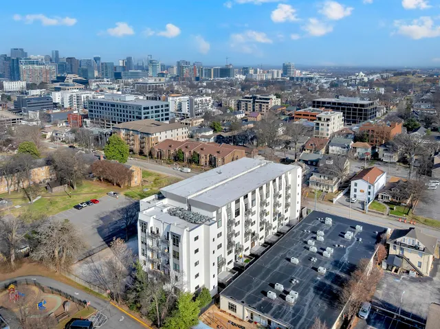 a view of a street with a building in the background