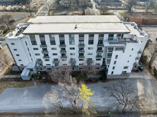 a bathroom with a granite countertop shower