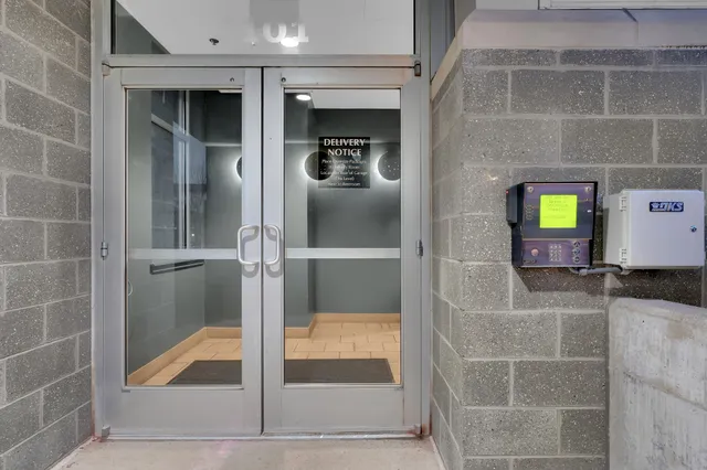 a view of parking garage with cars