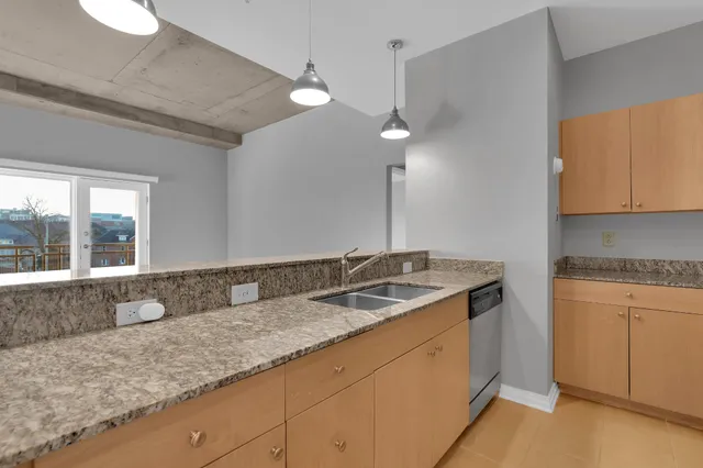 a kitchen with granite countertop a sink and a granite counter tops