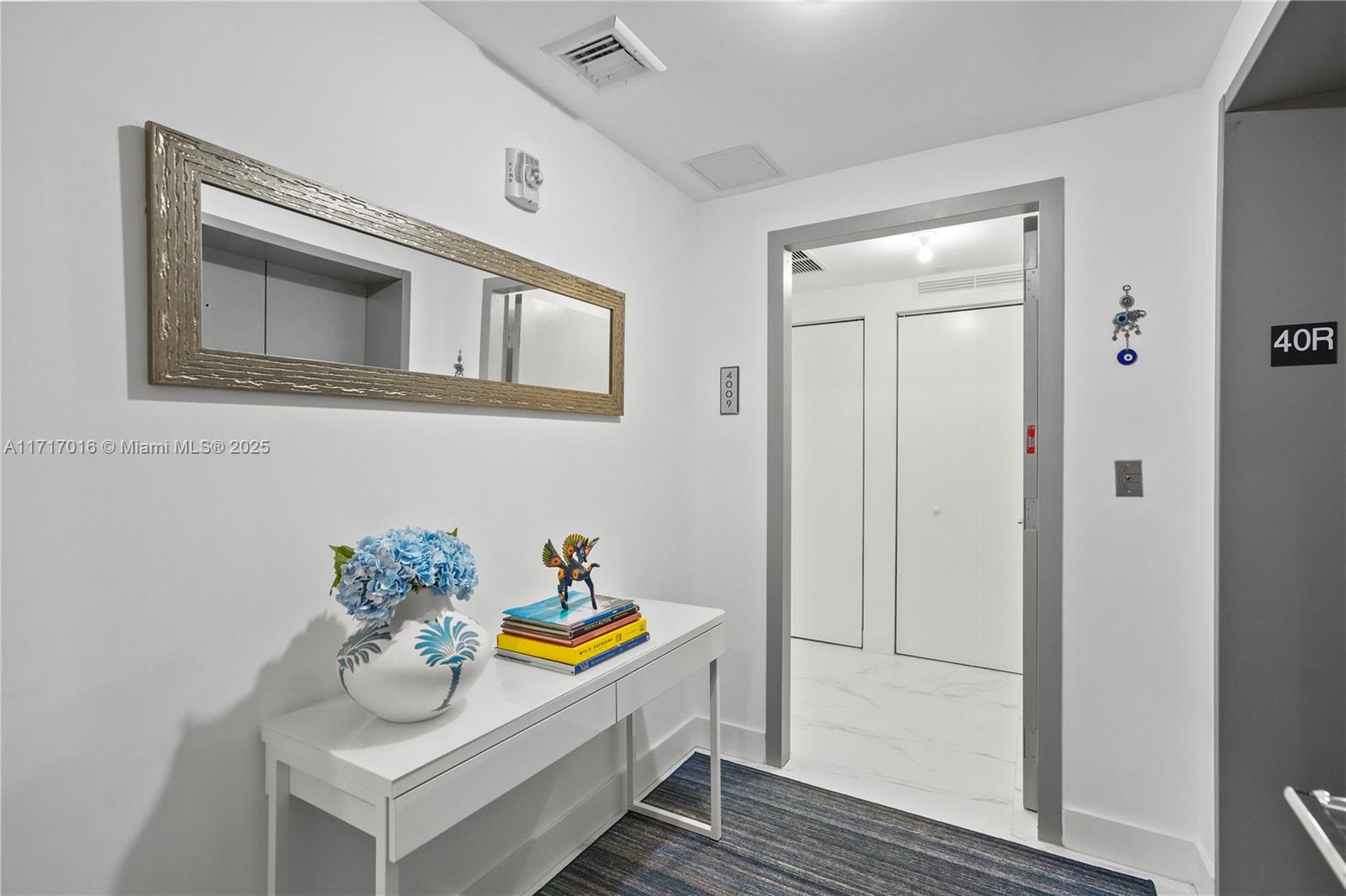 488 Northeast 18th Street, Unit 4009 Miami, FL 33132 - Photo 21 of 44 a view of dining room and wooden floor