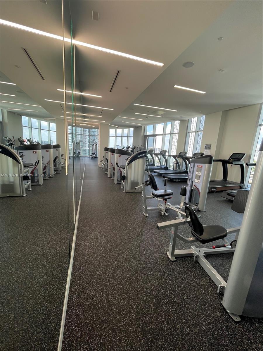 488 Northeast 18th Street, Unit 4009 Miami, FL 33132 - Photo 31 of 44 a view of a room with gym equipment
