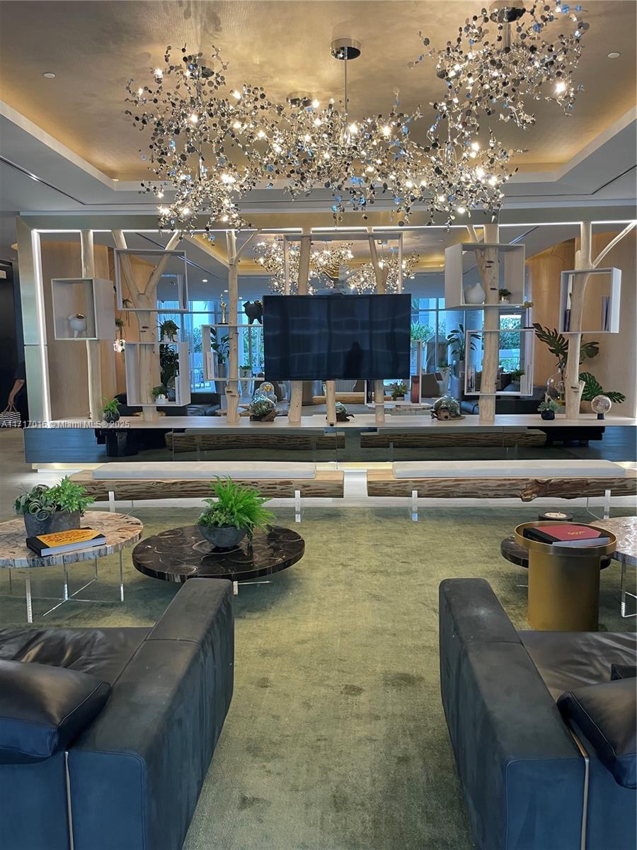 488 Northeast 18th Street, Unit 4009 Miami, FL 33132 - Photo 33 of 44 a living room with furniture and a kitchen