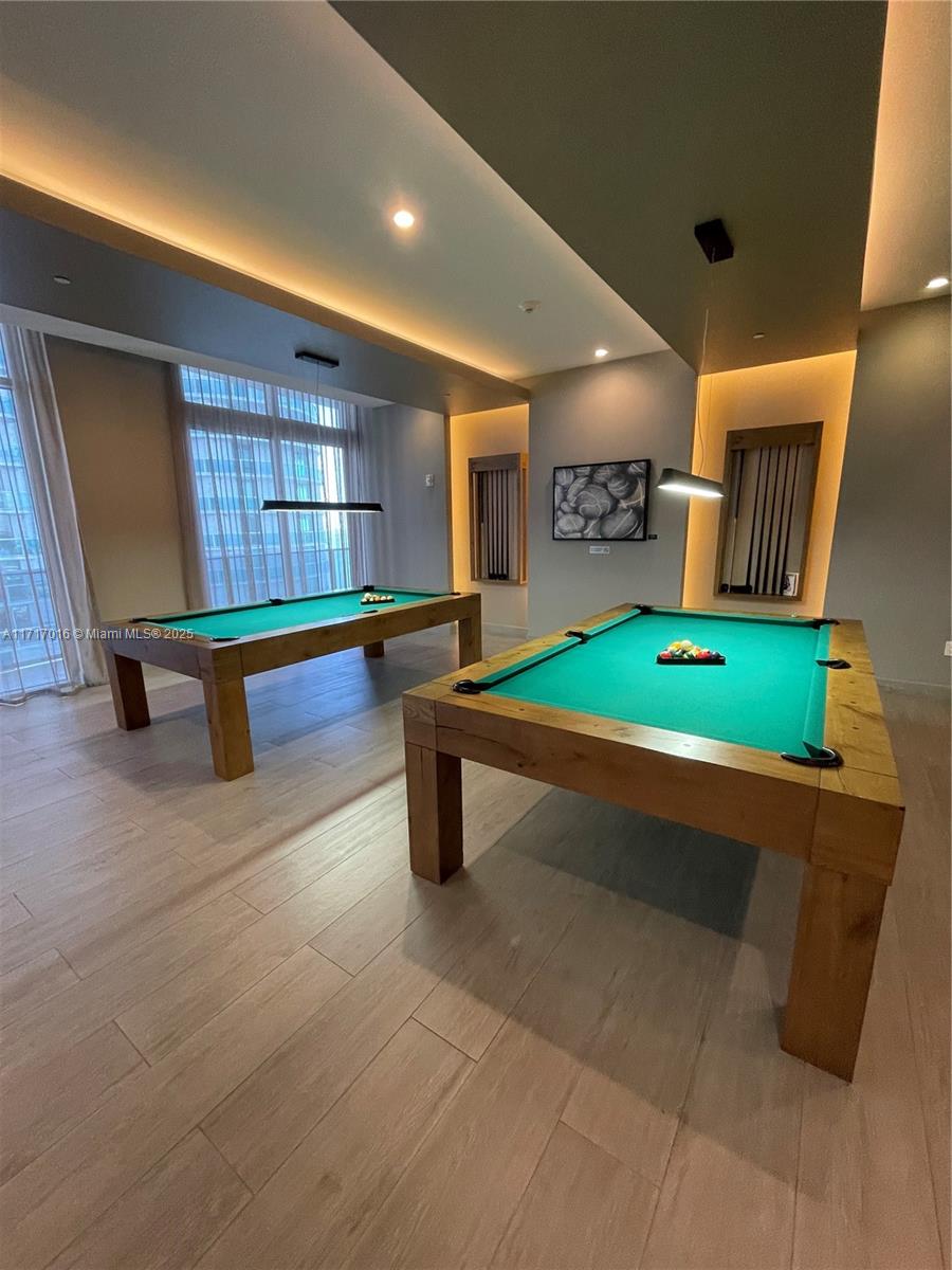 488 Northeast 18th Street, Unit 4009 Miami, FL 33132 - Photo 37 of 44 a room with pool table table soccer and windows