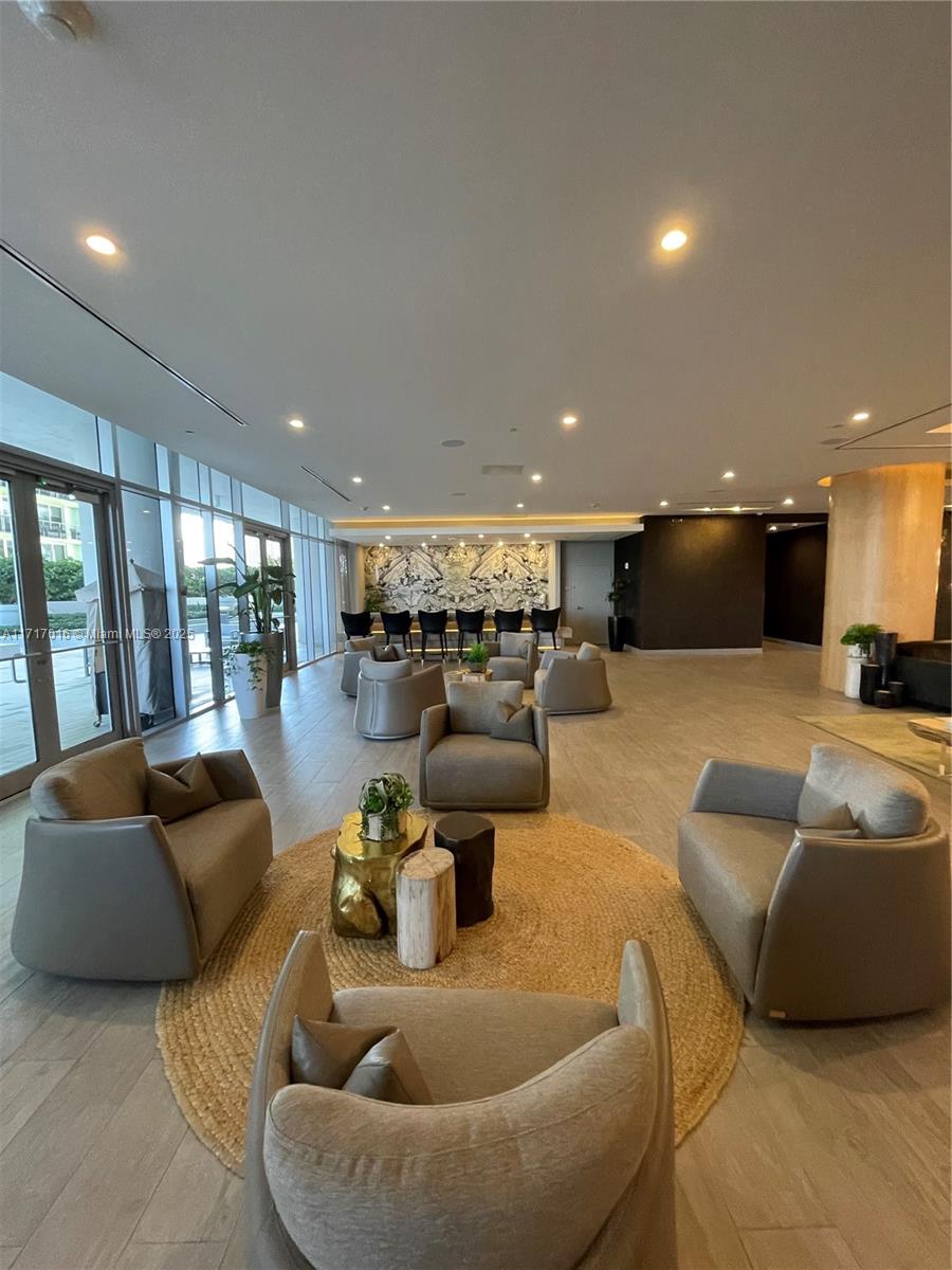 488 Northeast 18th Street, Unit 4009 Miami, FL 33132 - Photo 38 of 44 a living room with furniture and a large window