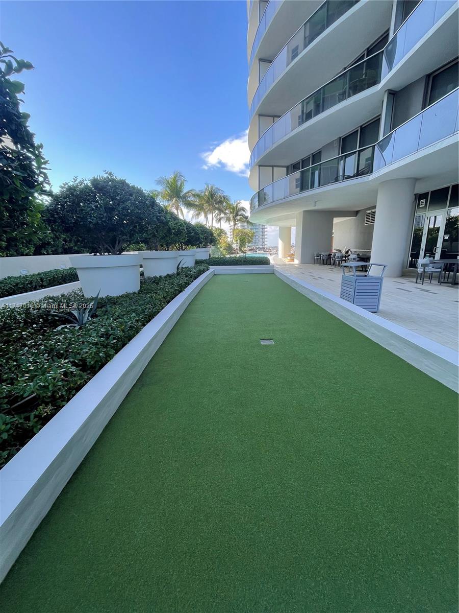 488 Northeast 18th Street, Unit 4009 Miami, FL 33132 - Photo 41 of 44 a view of a house with a yard porch and sitting area