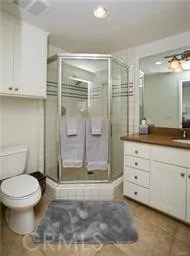 a bathroom with a shower toilet and sink
