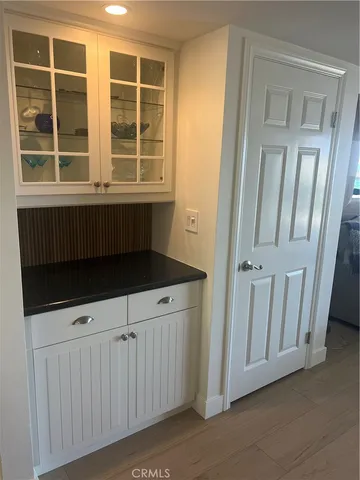a balcony with furniture and a potted plant