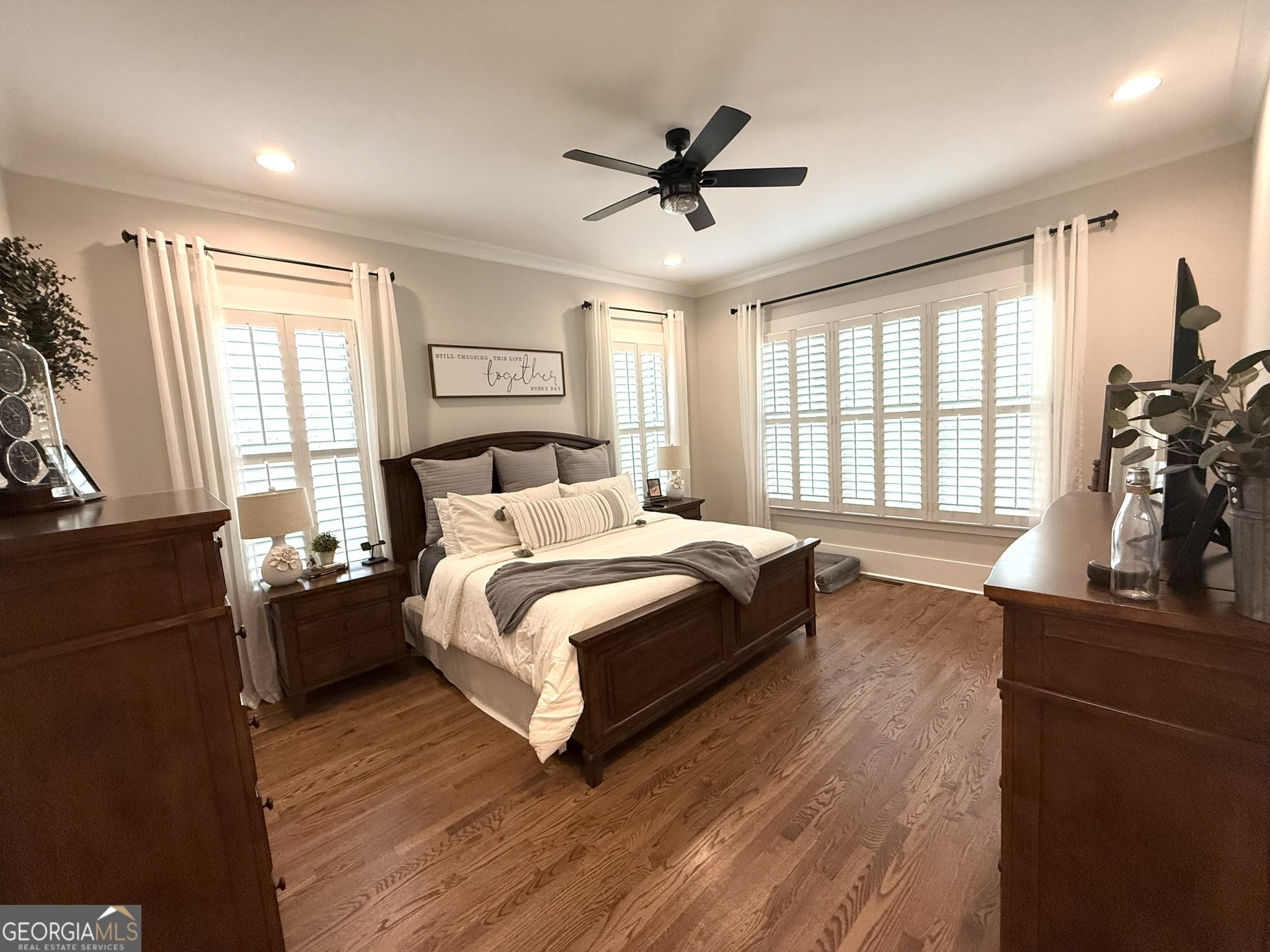 120 Spring Creek Drive Rutledge, GA 30663 - Photo 18 of 38 a spacious bedroom with a bed and wooden floor