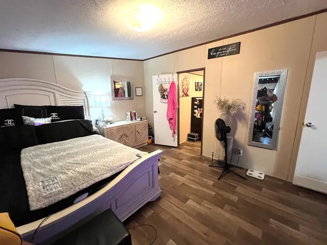 a bed room with furniture and a lamp